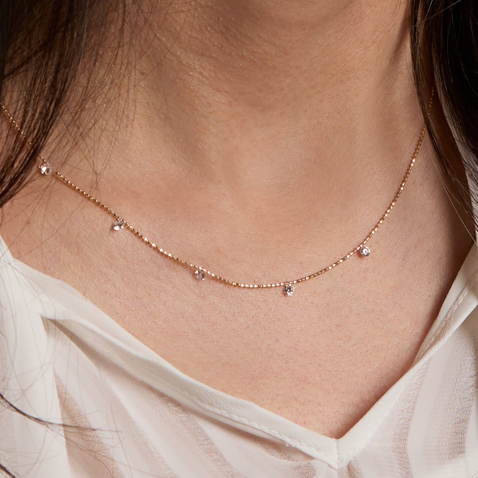 Yellow Gold Floating Diamond Necklace - Five Diamonds - On Neck