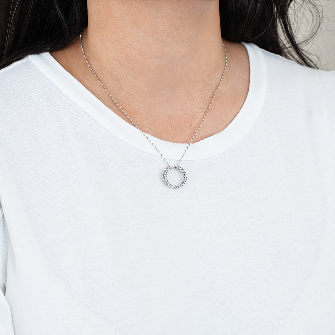 Silver Blue Topaz Circle Pendant - On Neck