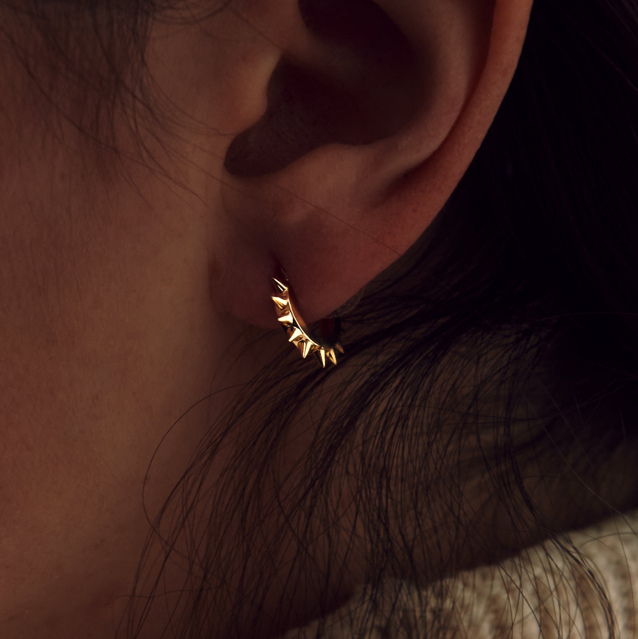 Yellow Gold Spike Huggie Earrings - On the ear